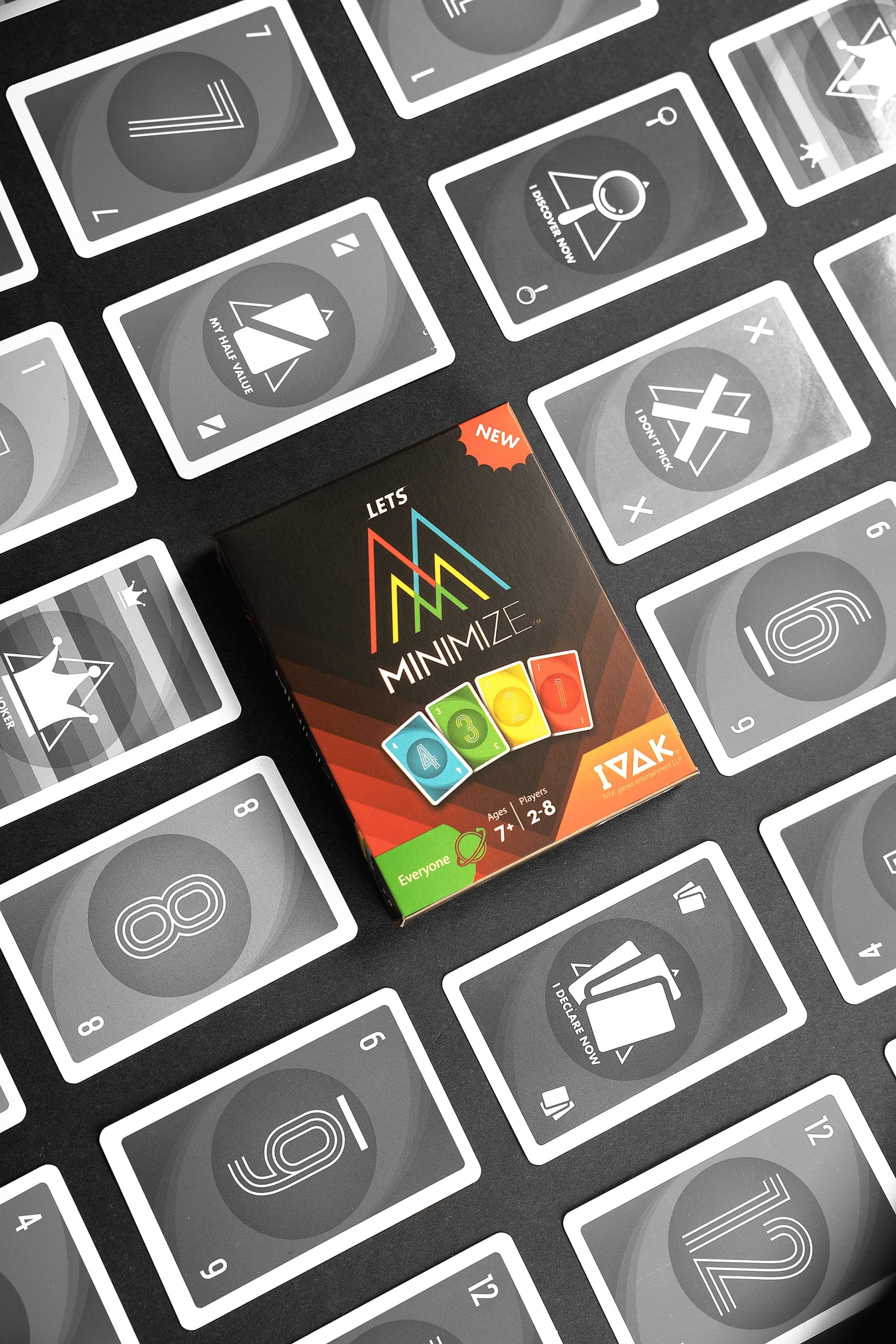 Four Minimize card game boxes lined up